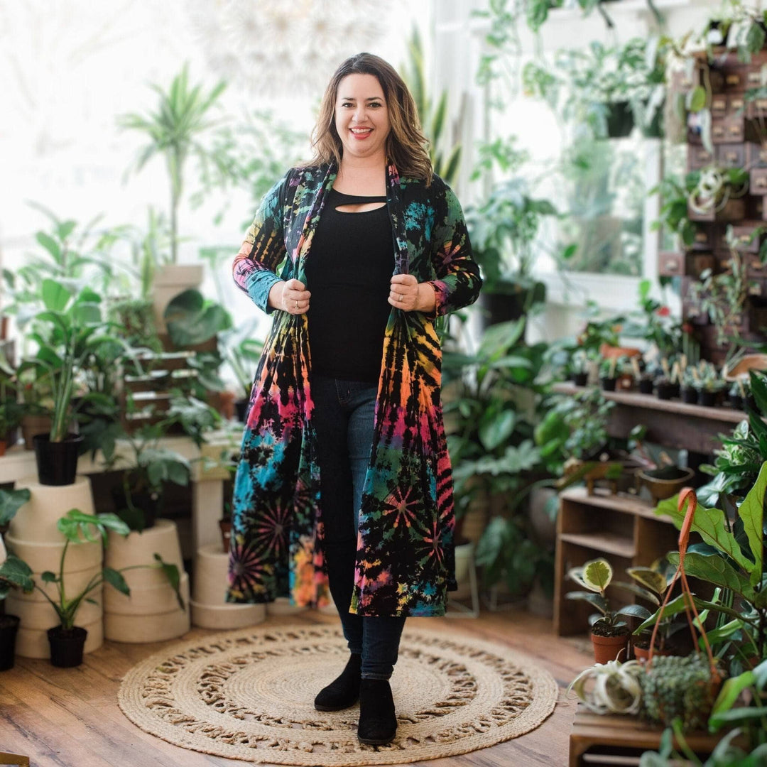 A woman sanding wearing cotton tie dye long cardigan.
