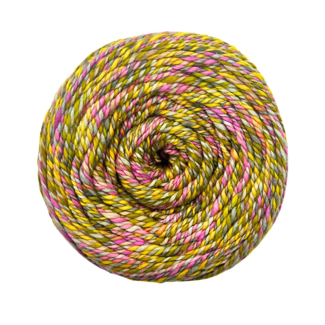 A yarn in a swirl pattern with green, yellow, and pink tones.