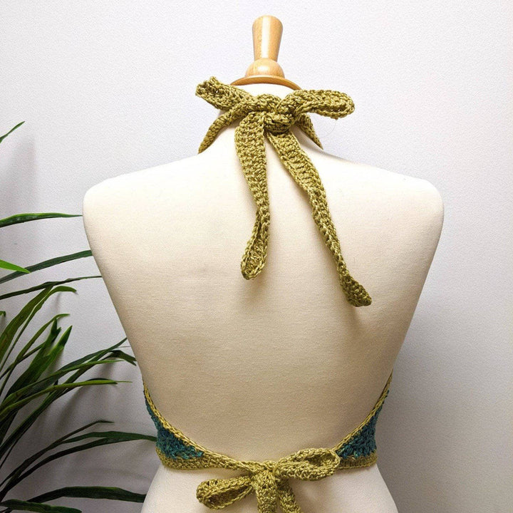 back view of a green bralette on a white background