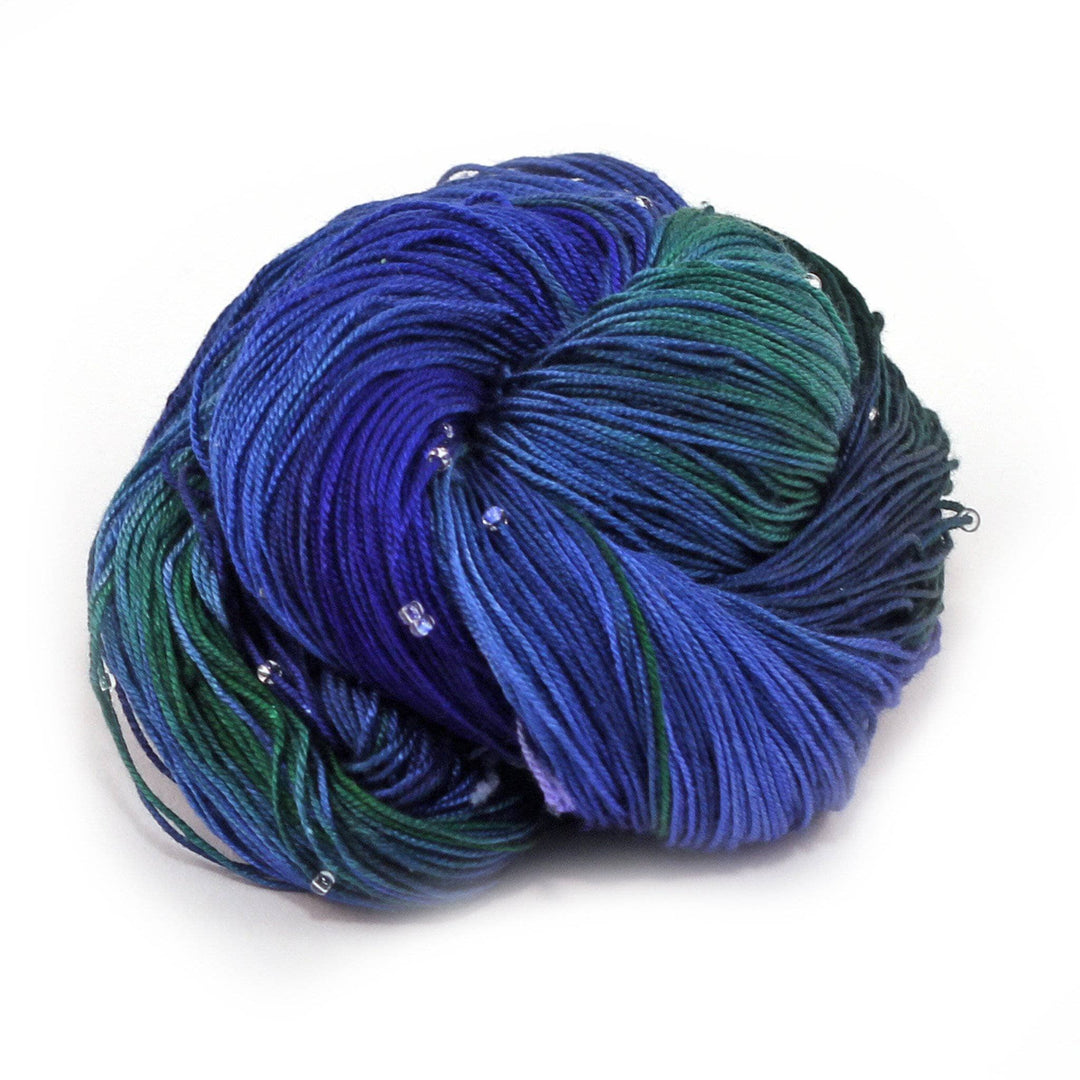 Hand Beaded Silk Yarn over a white background