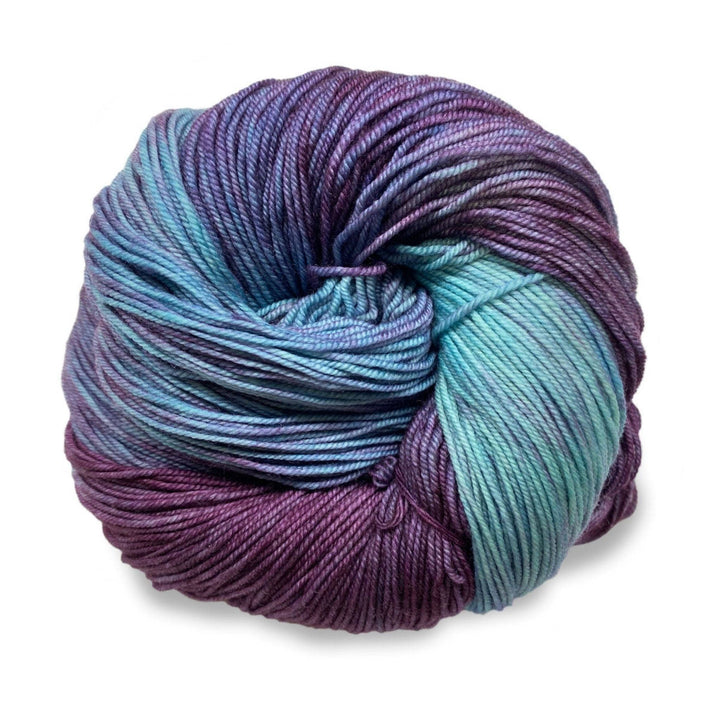 skein of light blue and purple yarn in front of a white background.