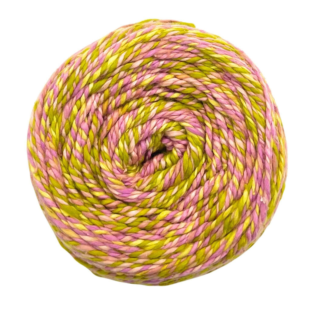 Yarn ball with pink and green swirls, smooth texture.