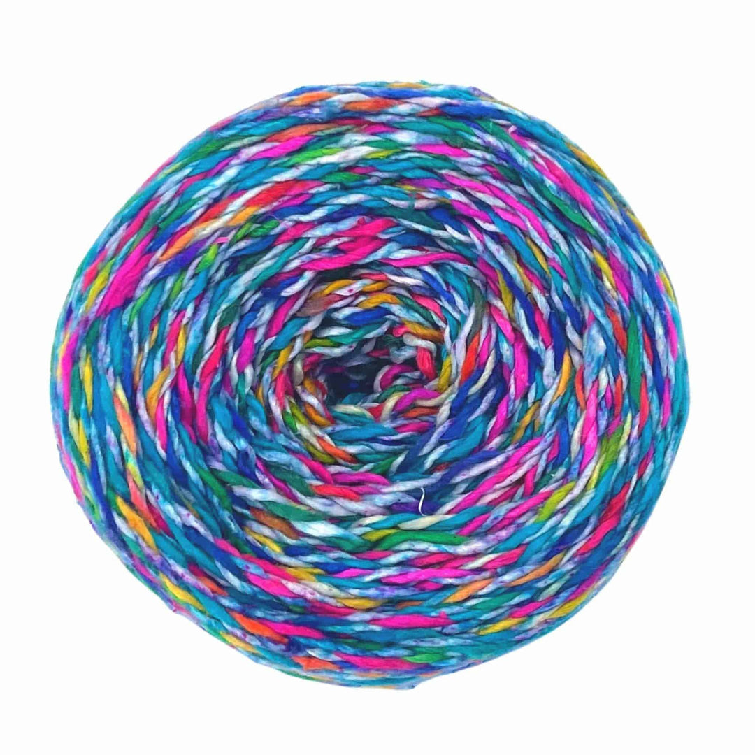 a cake of variegated twisted silk yarn in light blue, dark blue, pink, purple and yellow.