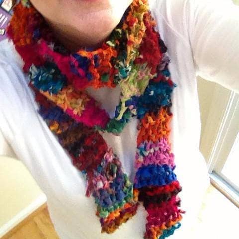 Woman wearing multicolor 86er Chiffon Scarf Pattern and a white tee shirt