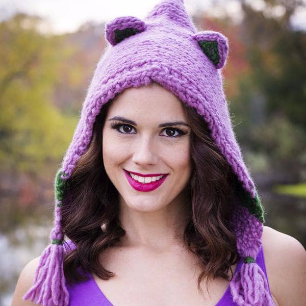 woman smiling wearing a Forest Friends Wool Hat outdoors