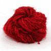Silk yarn donut ball in Cherry Red on a white background