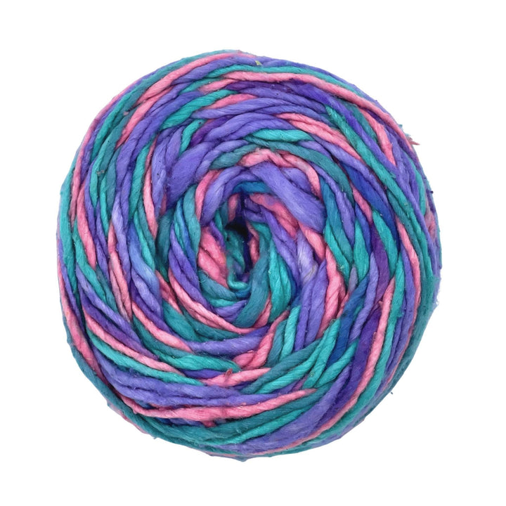 single ply recycled silk worsted weight green purple and pink yarn in front of a white background. 