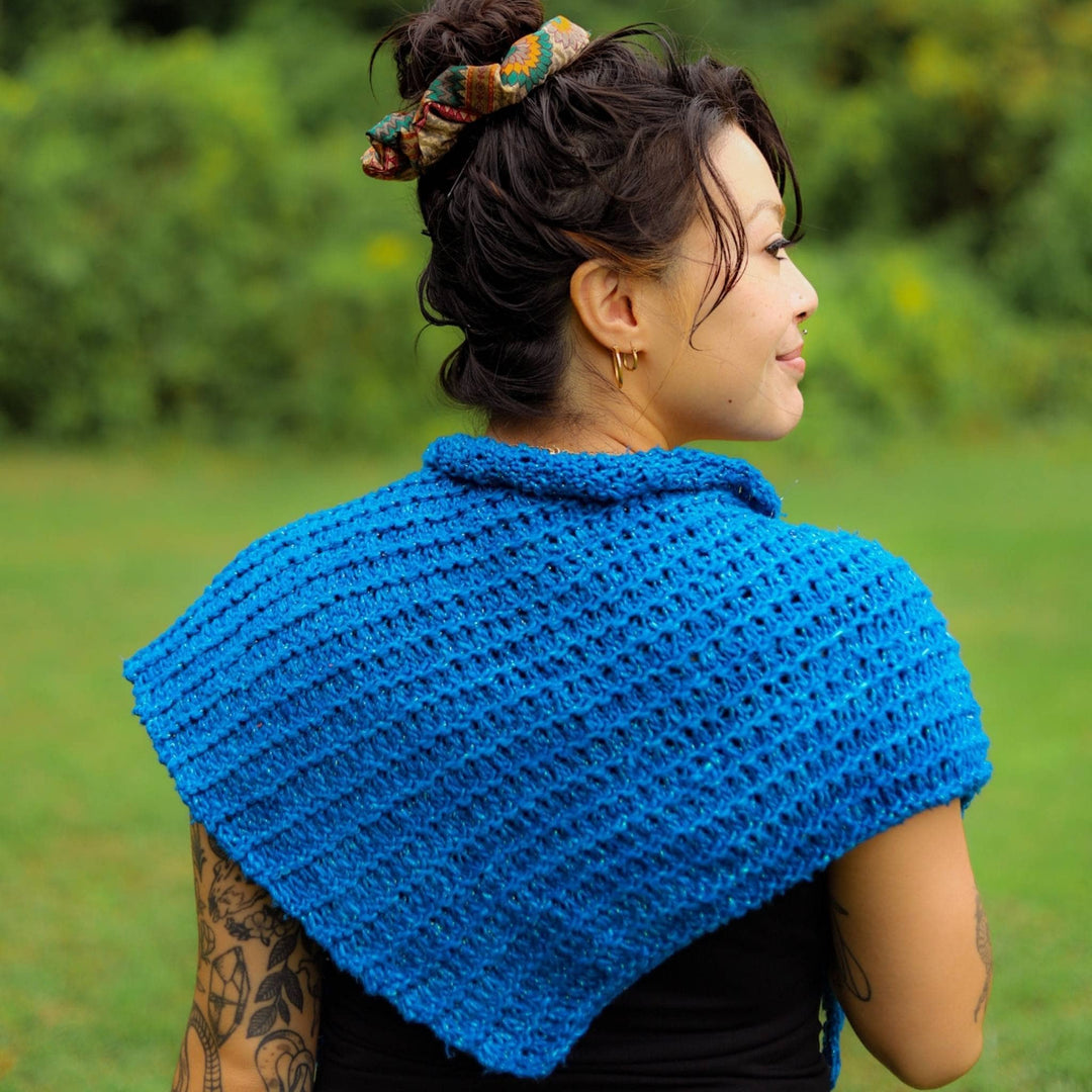Back view of model wearing a blue French hen shawl