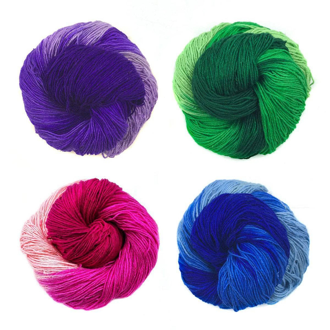 4 Skeins of Ombre Silk Yarn of different colors. Green, Blue, Purple, and Pink.