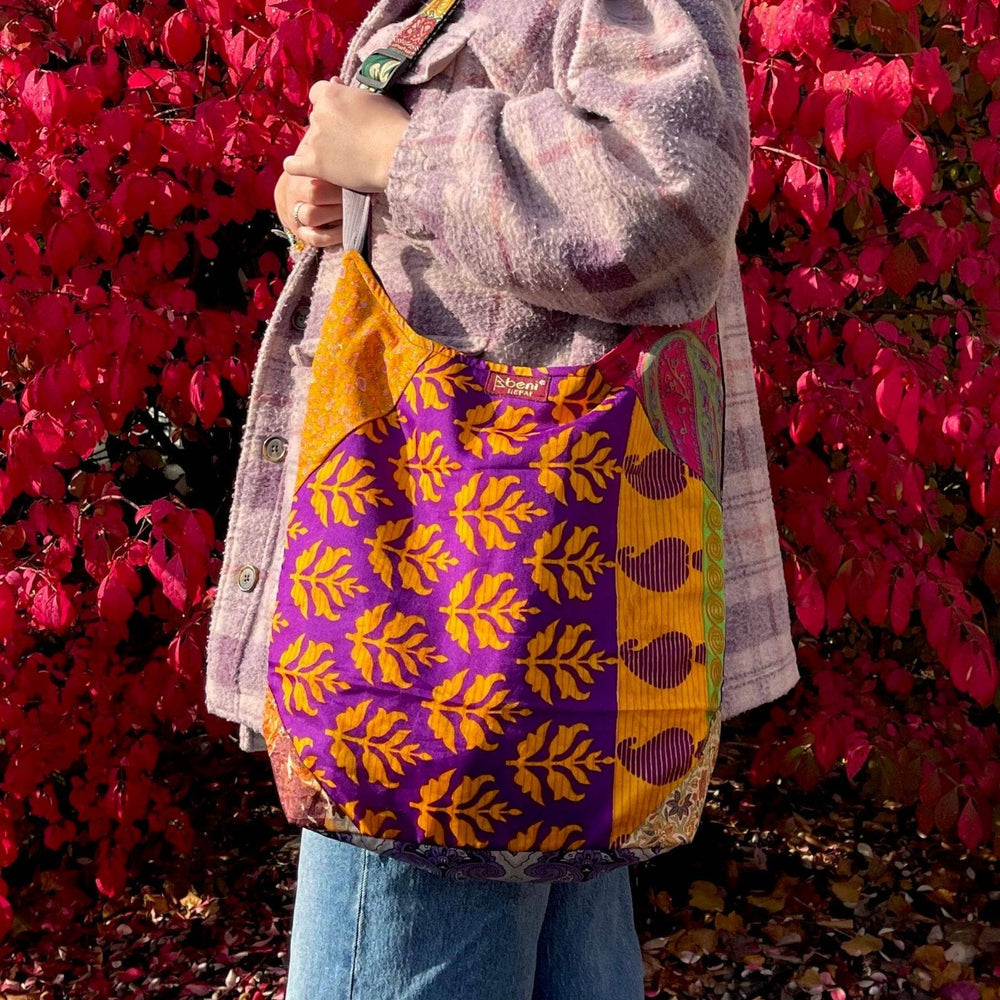 Girl holding a Sari Silk Purse over her shoulder on a Fall Day