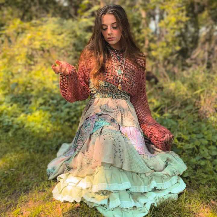 Girl posed in the forest wearing blue tone sedona dress
