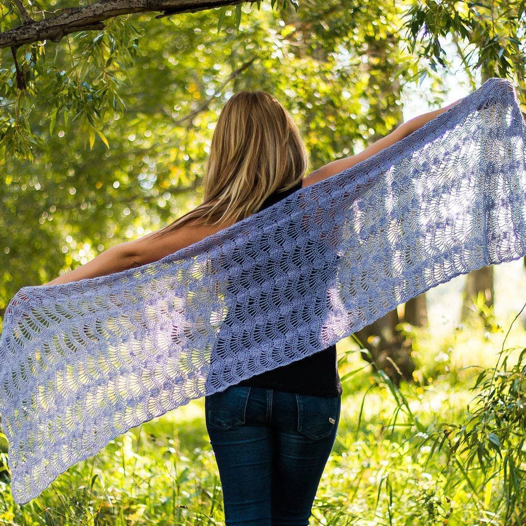 woman showing off her Silk Waves Shawl outdoors