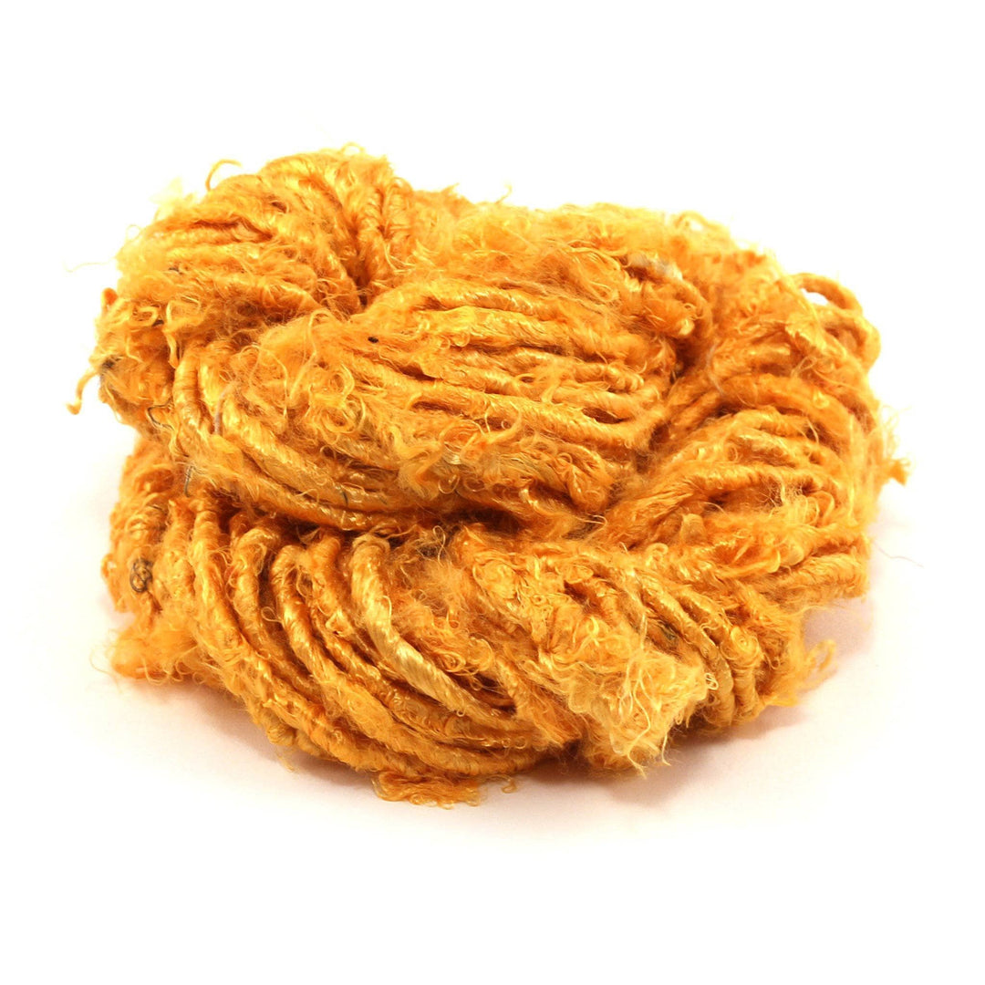 close up of yarn skein in the color sunflower (yellow)