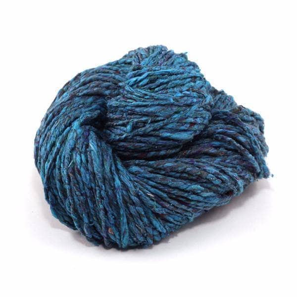 Spekcled Tweed Recycled Silk Yarn ball in Oceanic Blues on a white background