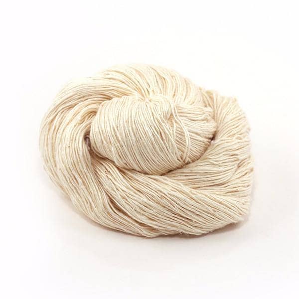 Lace Weight Silk Cloud Yarn donut ball in white on a white background