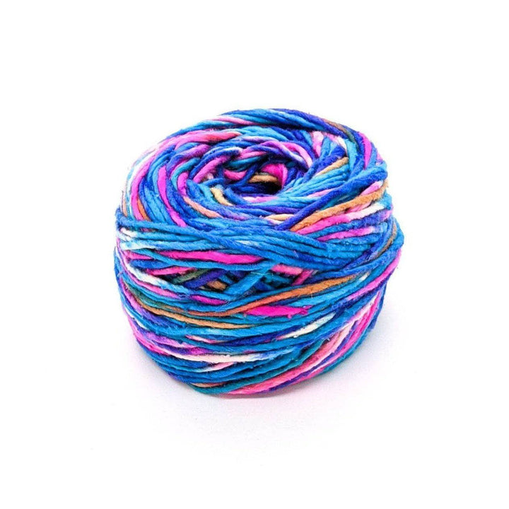 A cake of blue, pink, white, tan, and purple yarn on a white background
