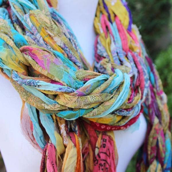 Close up of mannequin wearing 30 Minute Arm Knit Scarf