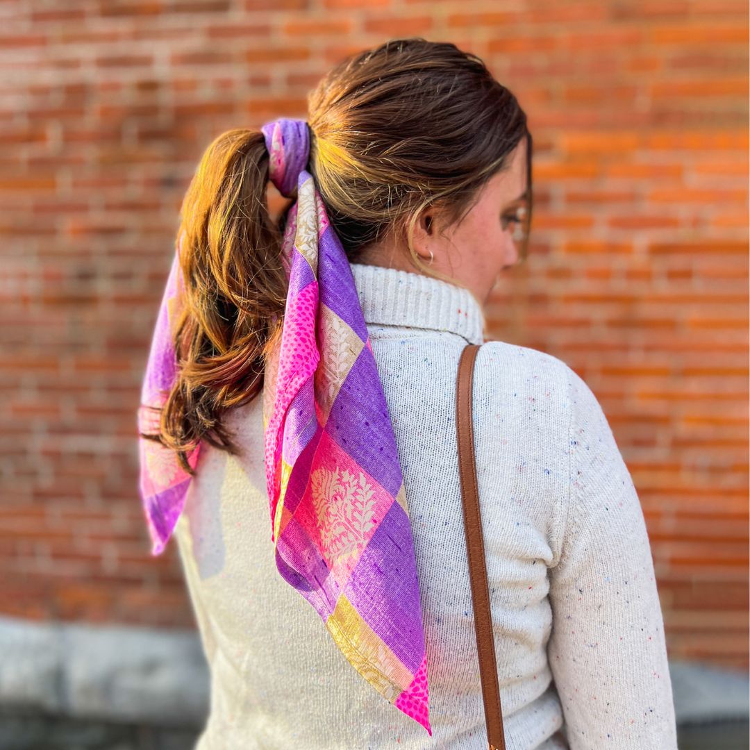 Sustainable Silk Head Scarf in pink and purple tones worn tied around model's ponytail