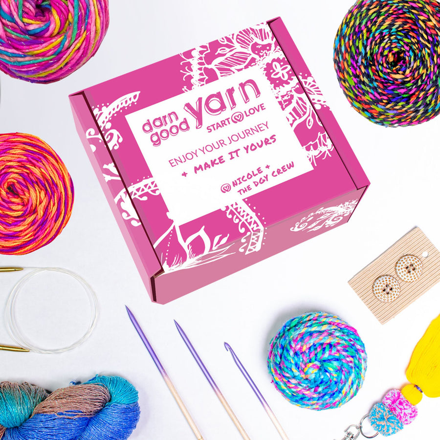 Darn Good Yarn Yarn of the Month Club box with three skeins of hand-dyed recycled silk yarn