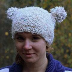 Woman wearing Arctic Snowball Hat in white 