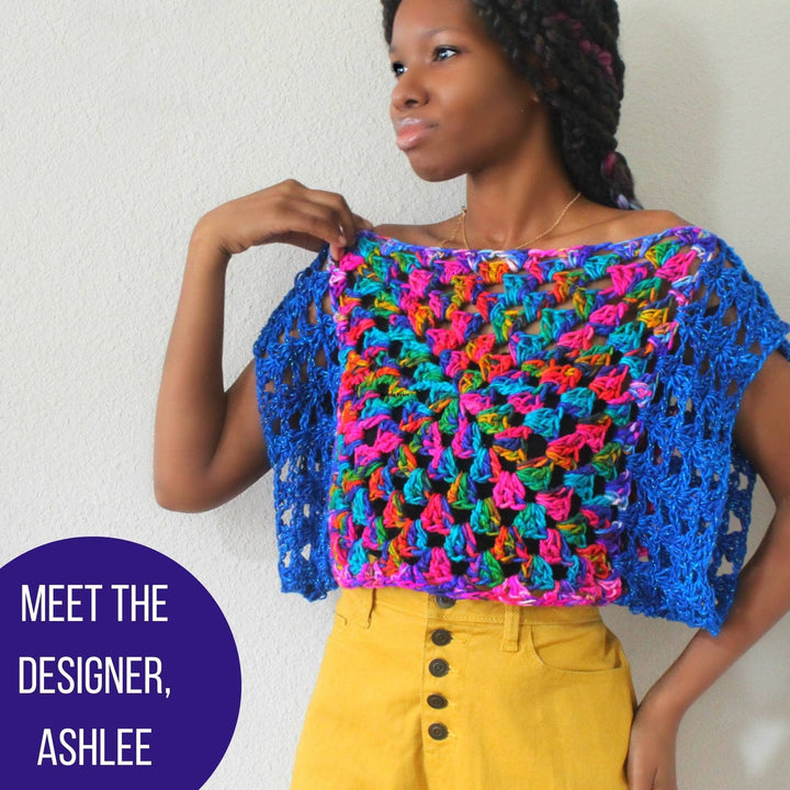 Designer Ashlee wearing a vibrant crochet top.