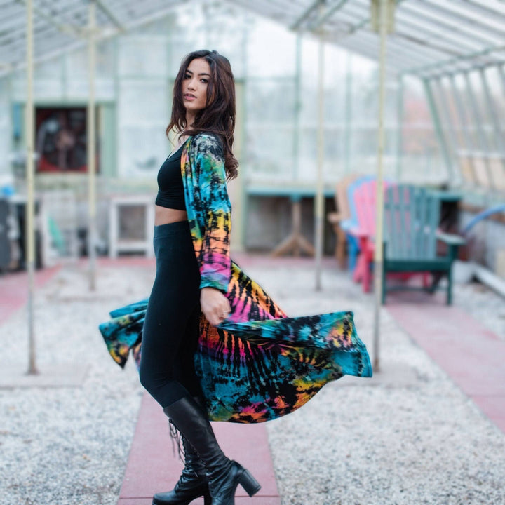 A woman wearing a cotton tie dye long cardigan.