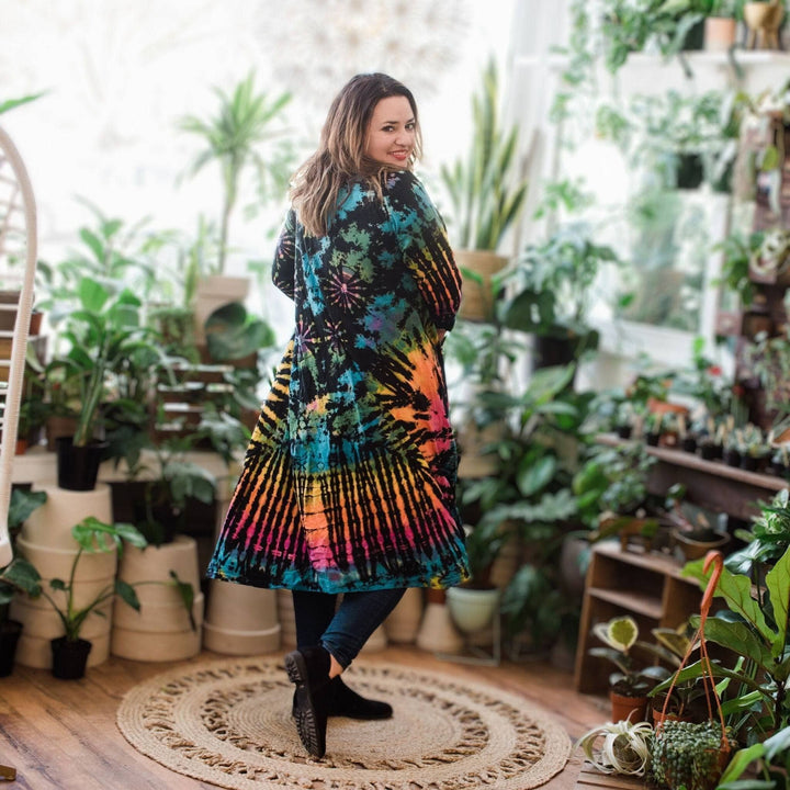 A woman wearing a cotton tie dye long cardigan.