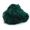 Silk yarn donut ball in Irish Hills (dark green) on a white background