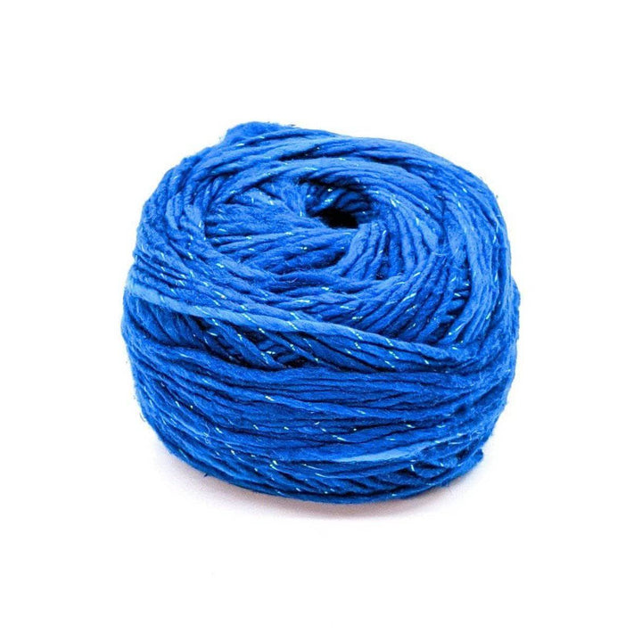 A cake of sparkle blue yarn on a white background