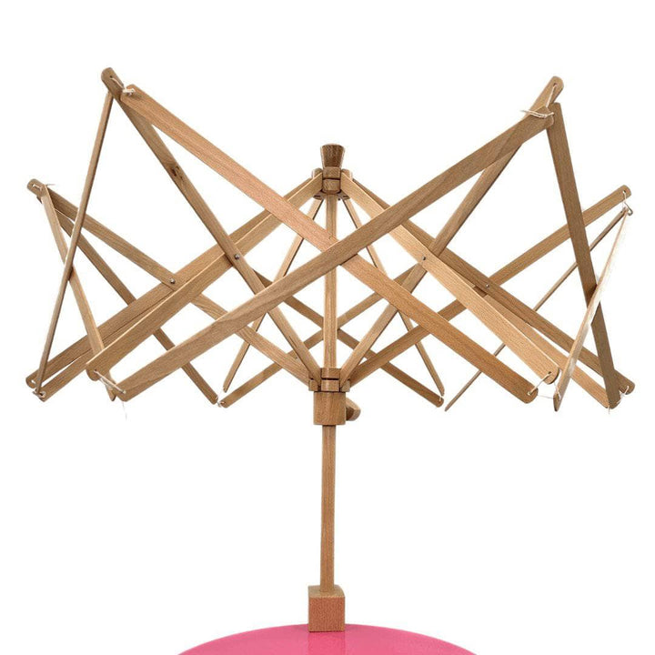 A wooden yarn swift in an open position.