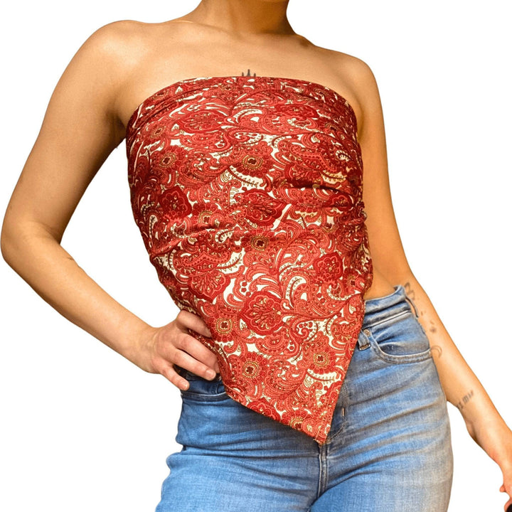 A close up of a woman wearing sari scarf top.