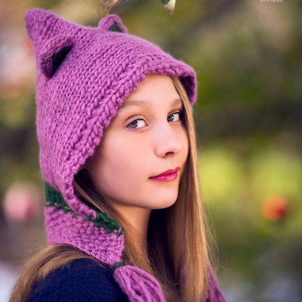 Kid smiling wearing a Forest Friends Wool Hat outdoors