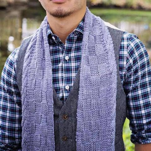 man wearing a purple scarf outdoors