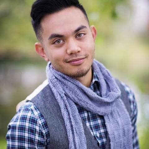 man wearing a purple scarf outdoors