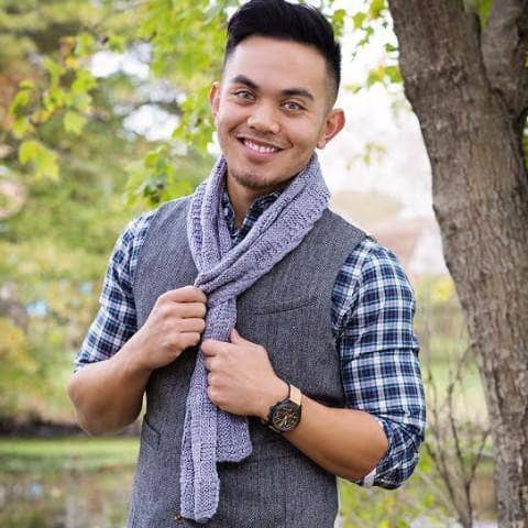man wearing a purple scarf outdoors