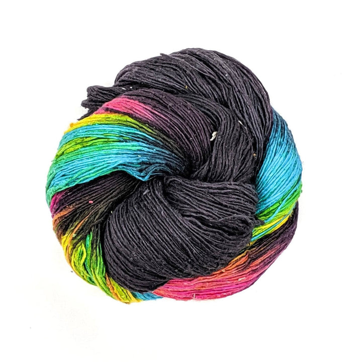 black and rainbow skein of yarn on a white background
