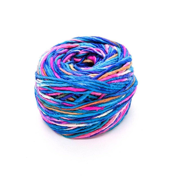 A cake of blue, pink, white, tan, and purple yarn on a white background
