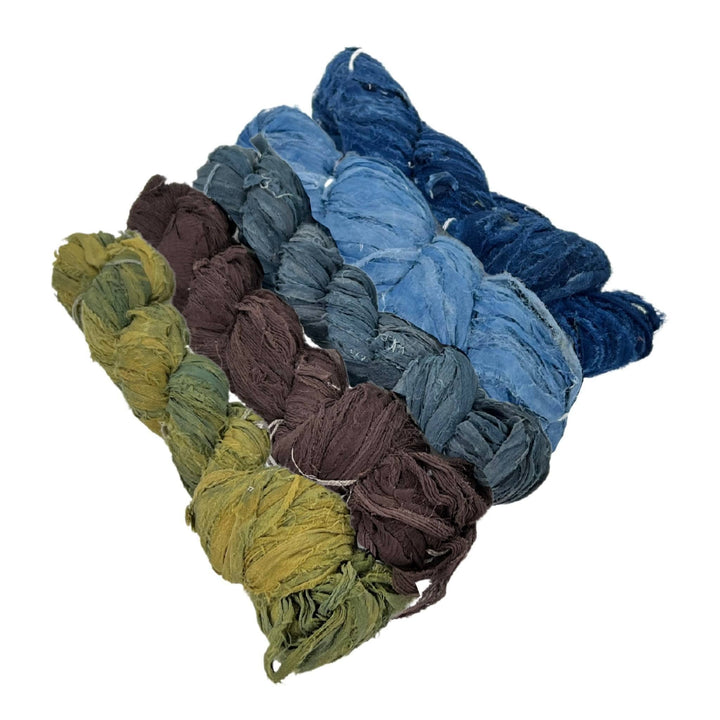 reclaimed ribbon yarn cool colors, blues, greens, and brown.