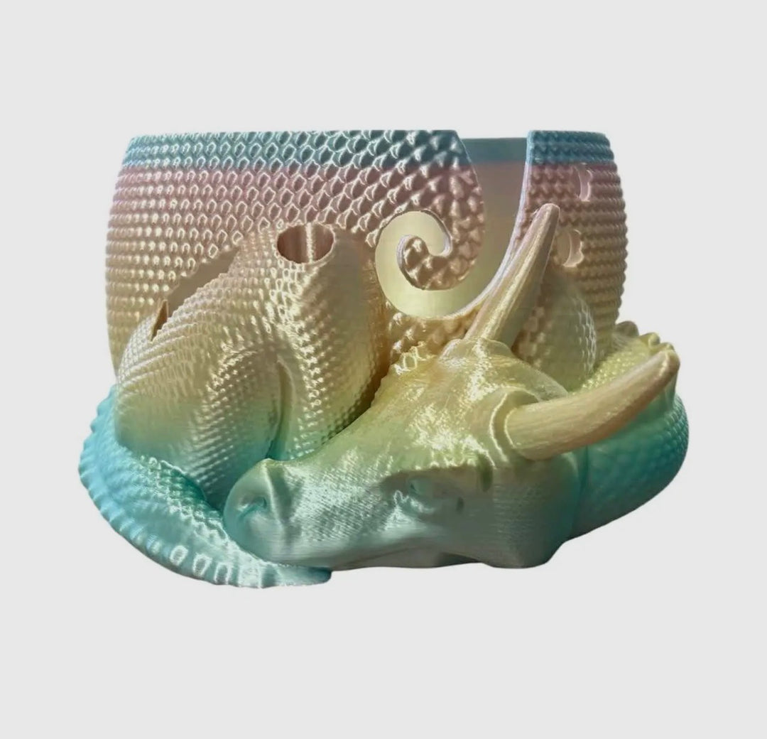 Decorative item resembling a dragon head with textured surface on a light gray background