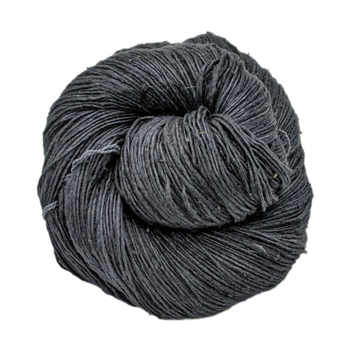 Single ply black lace weight silk in front of a white background. 