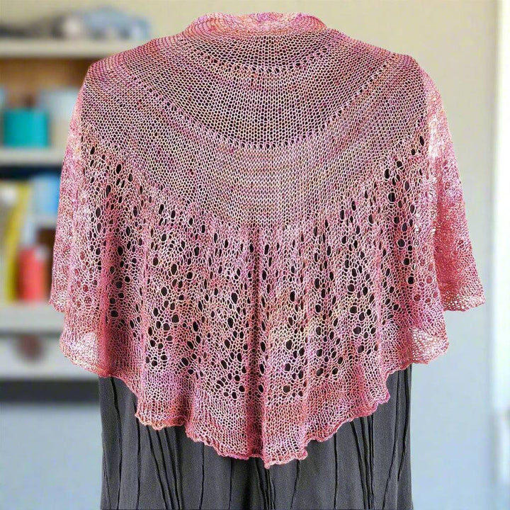 mannequin wearing a pink shawl