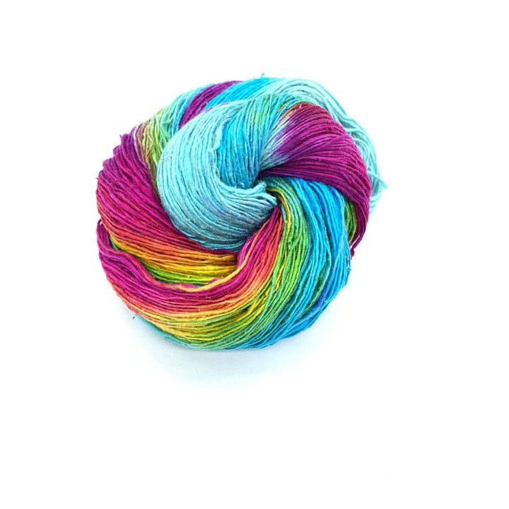 blue and rainbow skein of yarn on a white background