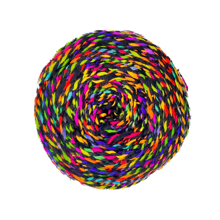 A rolled multi-colored weight yarn.