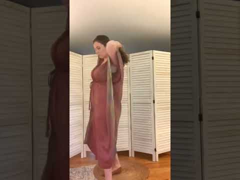 A woman showing how to wear an Aanya Adjustable Long Kaftan Dress from Darn Good Yarn.