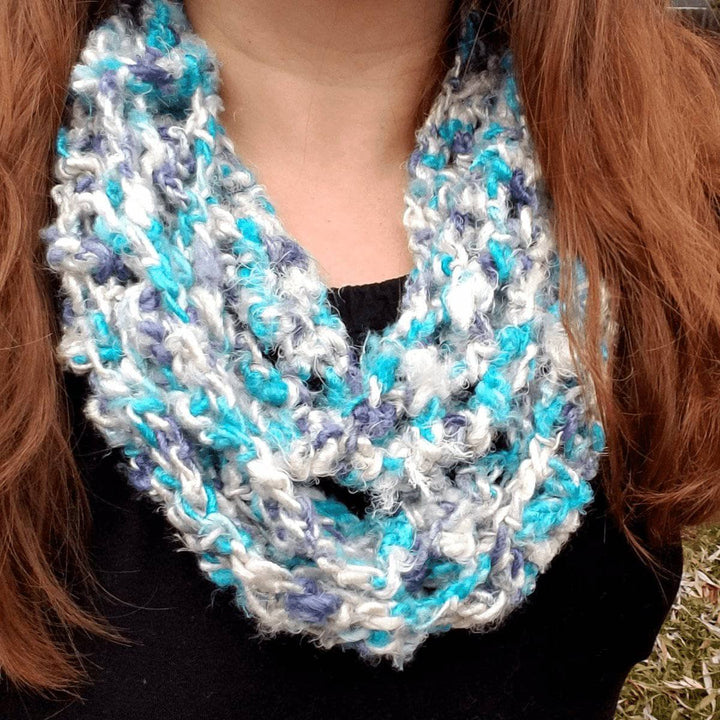 close up of a woman wearing a multicolored scarf