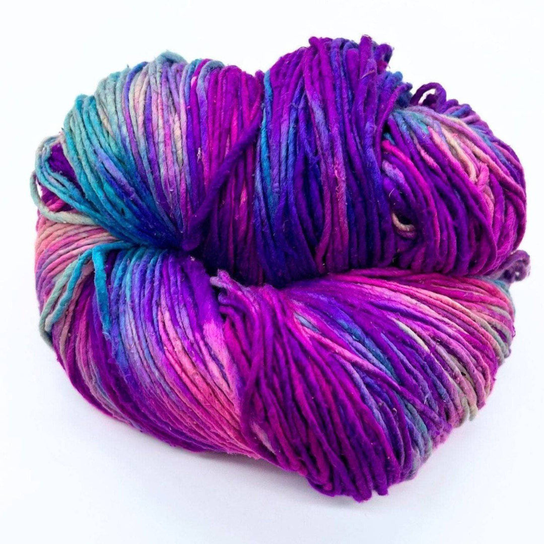 A skein of variegated yarn with purples, blues, and pinks.