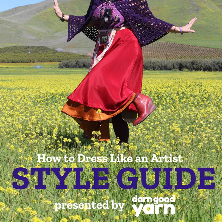 Artist, Deanna Bowers  in a field of flowers wearing a red maxi sari wrap skirt. Words over the image read How to Dress Like an Artist Style Guide. Presented by Darn Good Yarn. 