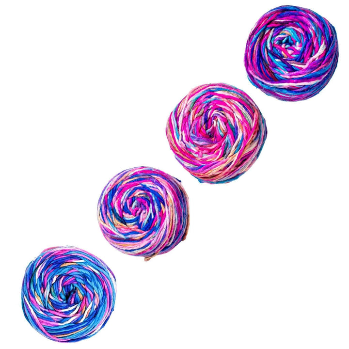 A bunch of multi-colorerd silk roving worsted weight yarn.