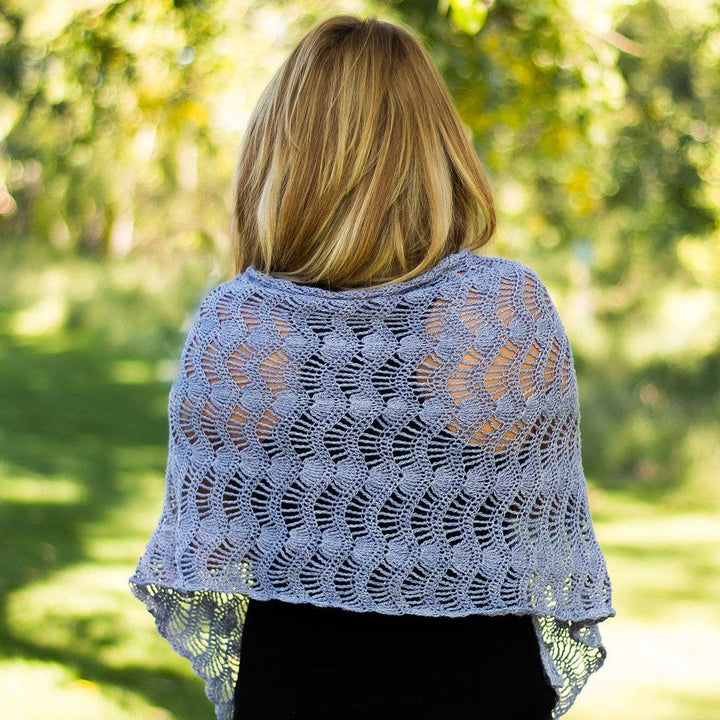 woman showing off her Silk Waves Shawl outdoors
