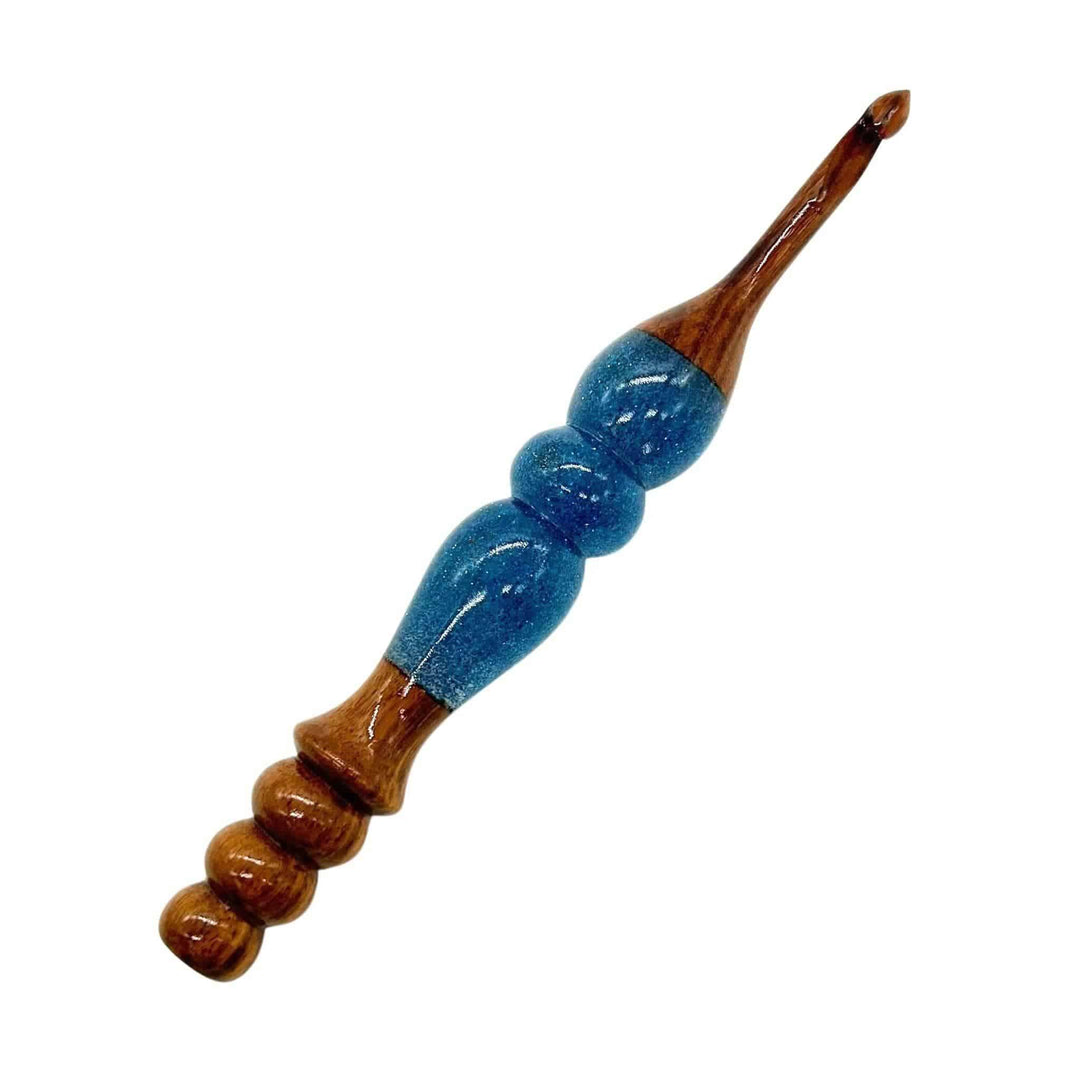 A wooden and resin crochet hooks.